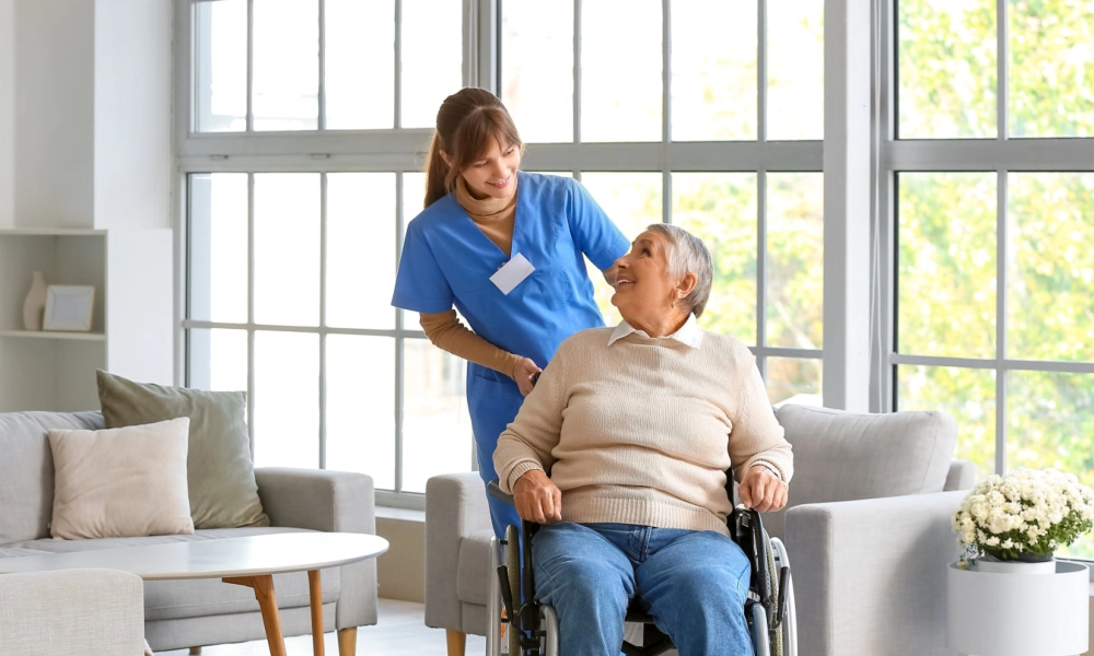 A female caregiver and a senior woman sitting on a wheelchair